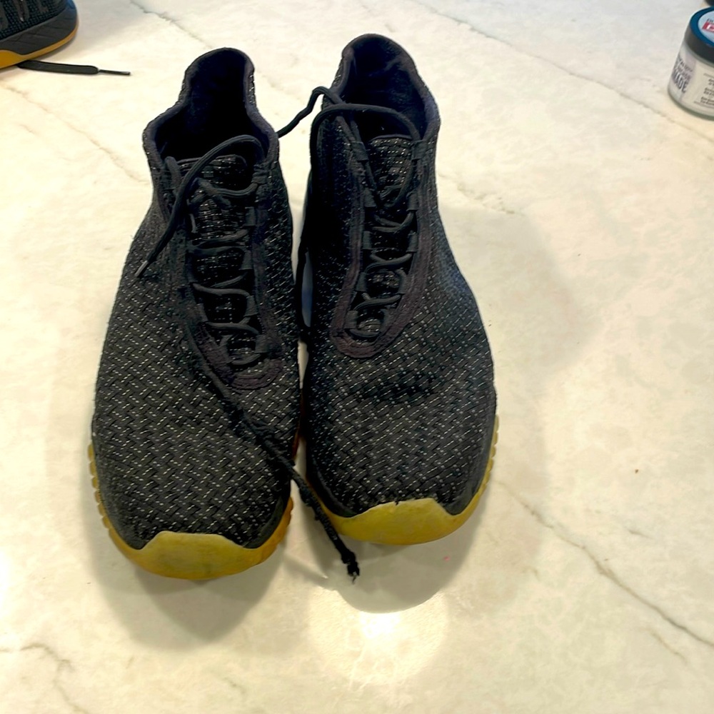 Jordan size 12, all black, and gold sole. In good condition